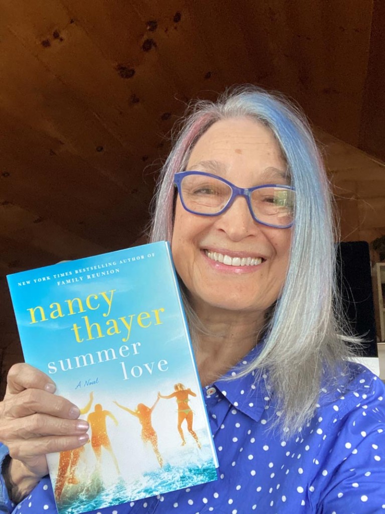 Nancy Thayer holding her book Summer Love