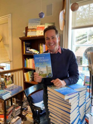 Tim Ehrenberg holding a copy of All the Days of Summer